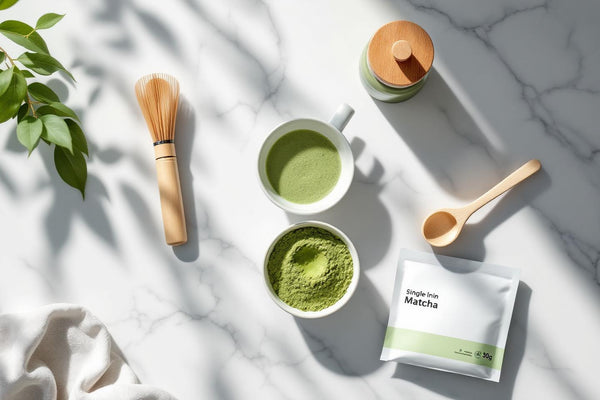 Best matcha starter kit for beginners flat lay with ceramic bowl, bamboo whisk, and matcha powder