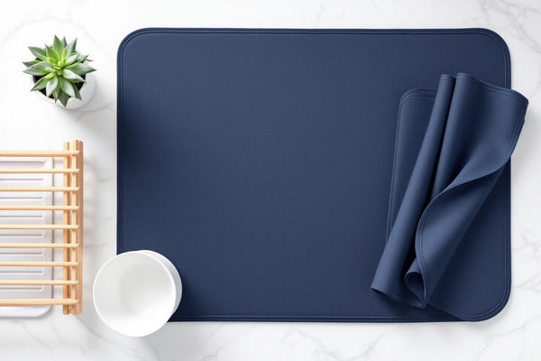 Eco friendly dish drying mat flat lay with ceramic bowls and bamboo rack on marble surface