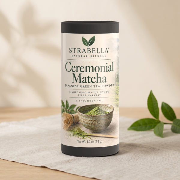 Strabella Asanagi ceremonial matcha tin styled on linen with fresh tea leaves