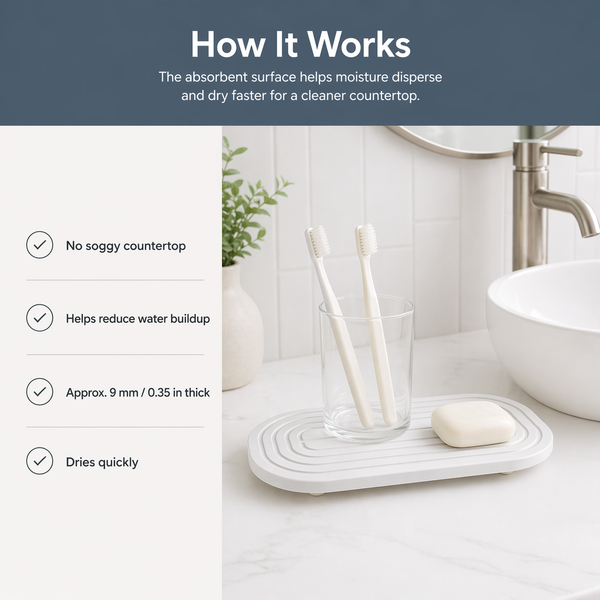 Diatomaceous sink tray in use — bathroom vanity with toothbrush cup and soap on absorbent stone tray
