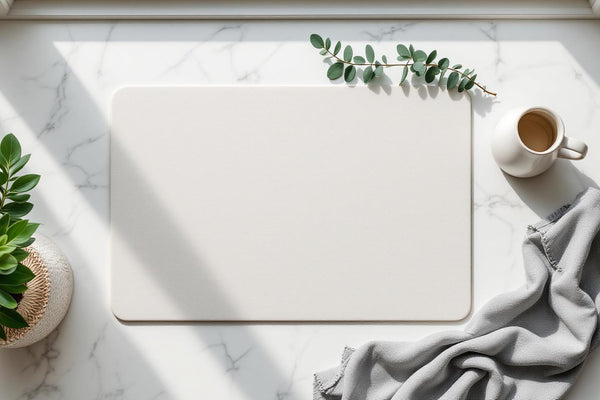 Eco friendly dish drying mat with ceramic dishes on a marble kitchen countertop