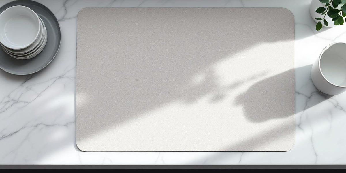 Eco friendly dish drying mat on marble kitchen counter with minimalist dishware and eucalyptus