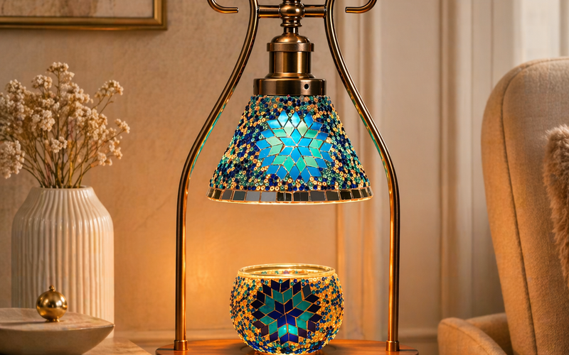 Blue mosaic candle warmer lamp on marble console