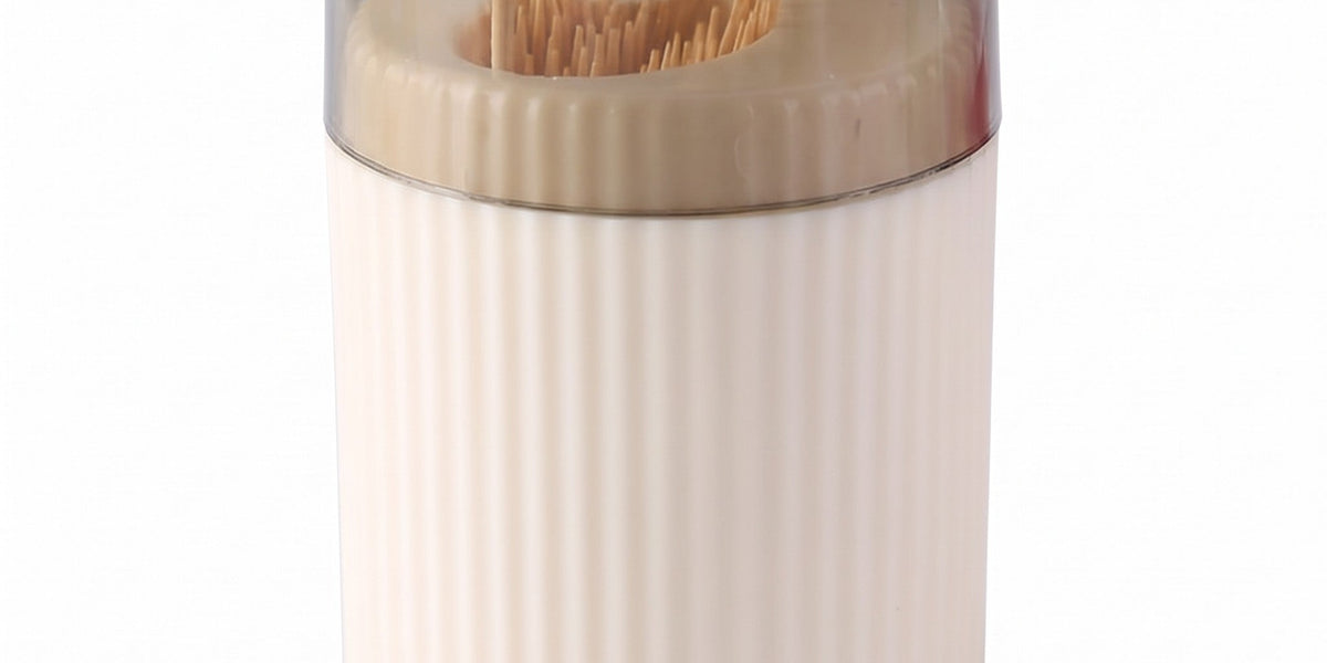 Pop-up toothpick holder in cream with one toothpick raised