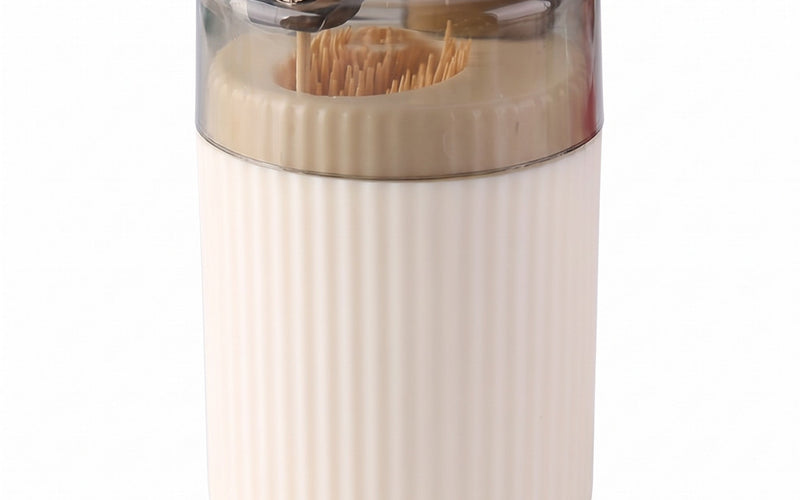 Pop-up toothpick holder in cream with one toothpick raised