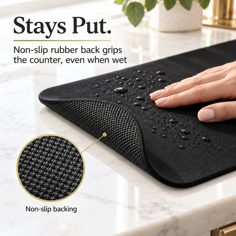 Close-up of the non-slip rubber backing on the black dish drying mat
