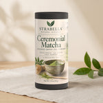 Strabella Asanagi ceremonial matcha tin styled on linen with fresh tea leaves