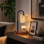 Crystal candle warmer lamp on console beside framed art and green plant — modern home décor
