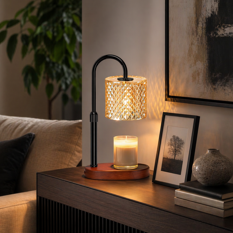 Crystal candle warmer lamp on console beside framed art and green plant — modern home décor
