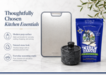 Thoughtfully chosen kitchen essentials — modern prep surface, natural stone look, everyday seasoning staple