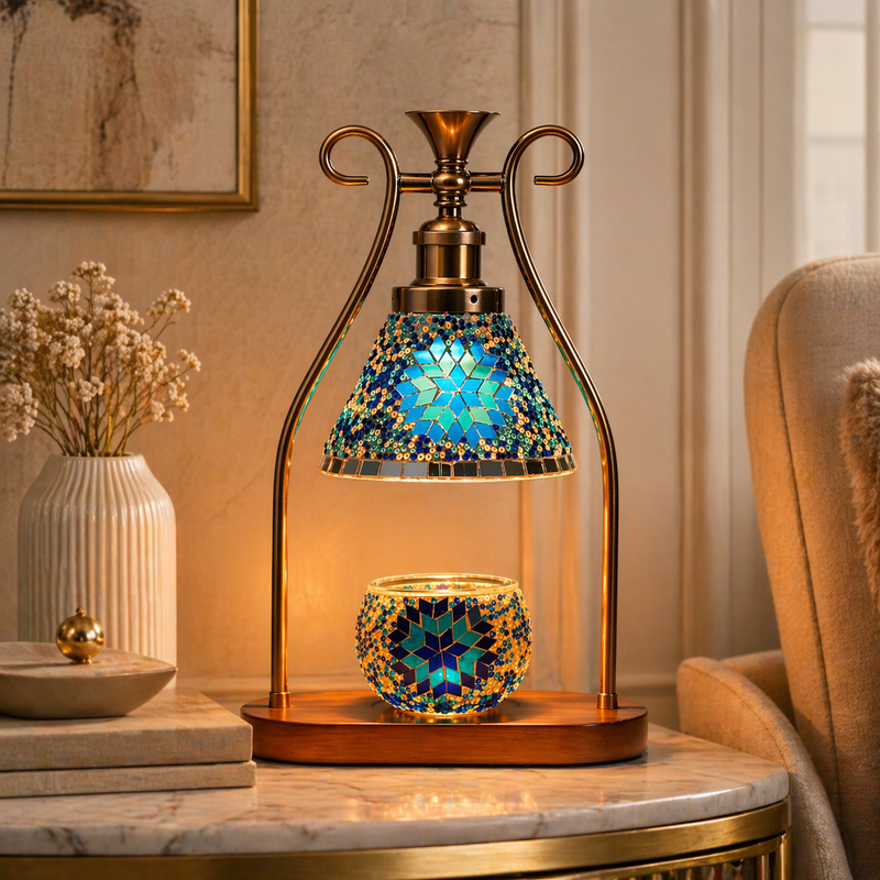 Blue mosaic candle warmer lamp styled on marble console with dried flowers and gold mirror
