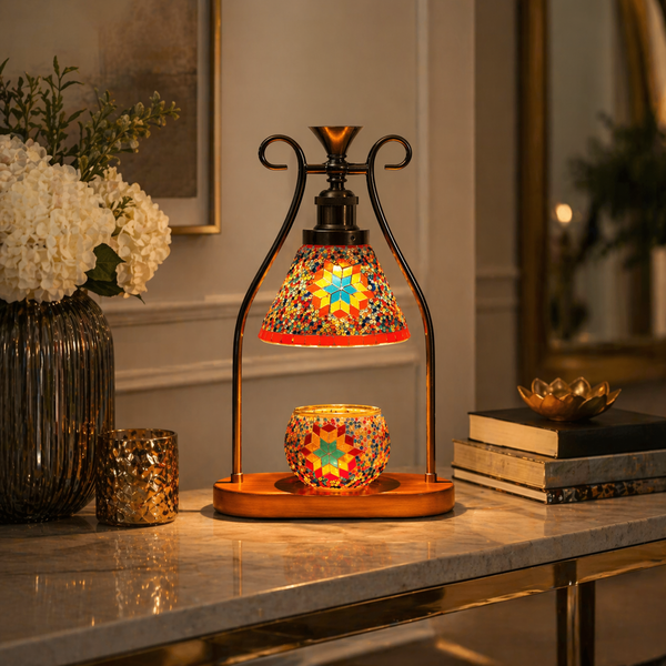 Orange mosaic candle warmer lamp styled on marble console with white hydrangeas and gold décor