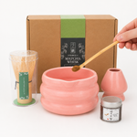 Whisking hojicha in the pink ceramic bowl of the Strabella Hojicha Set, with bamboo whisk and Kyoto hojicha powder