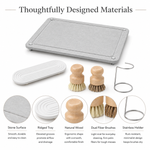 Thoughtfully designed materials — stone surface, ridged tray, natural wood, dual fiber brushes, stainless holder
