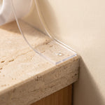caulk tape — close-up of the clear strip folded into a wall and counter corner