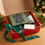Open red Christmas gift box with the Strabella 7-piece matcha whisk set, Asanagi ceremonial matcha tin and a note card