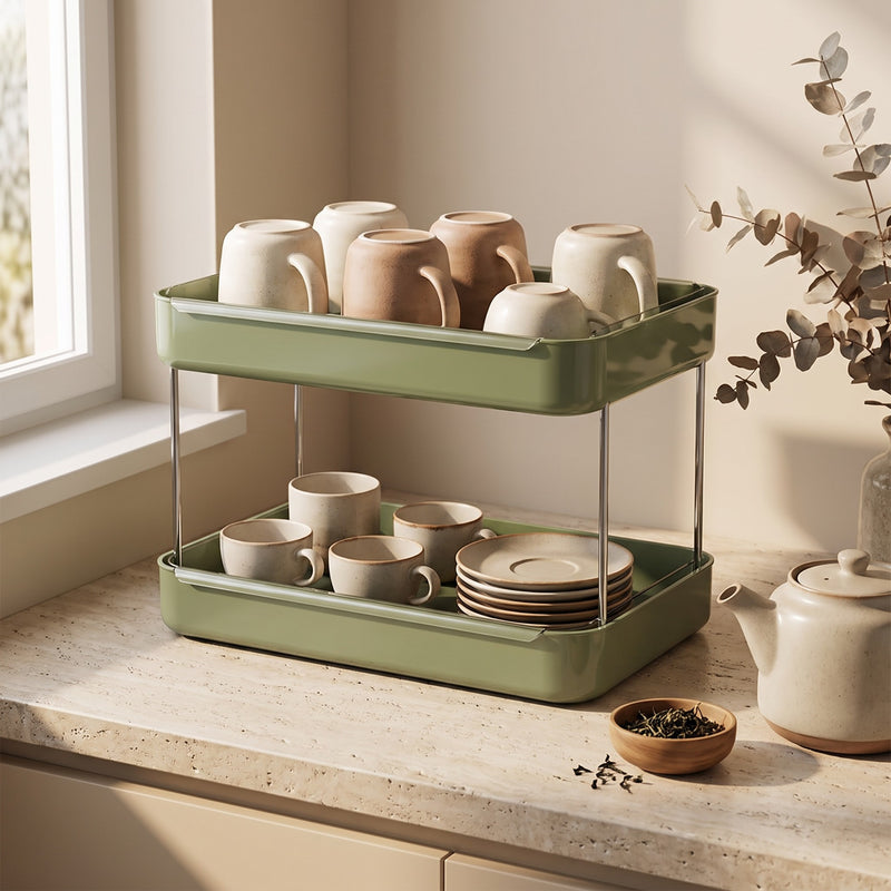 Coffee station organizer — sage green mug rack with ceramic mugs, teacups and a teapot