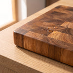 Close-up of the end-grain wood blocks and rounded corner of the wooden cutting board