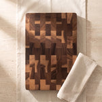 What is included — one large wood cutting board, top-down on cream linen