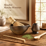 Gilt matcha ceremony set on a Japanese-inspired wooden table — ceramic bowl with bamboo whisk resting inside