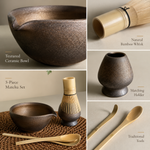 Gilt matcha ceremony set features — textured ceramic bowl, natural bamboo whisk, matching holder and traditional tools