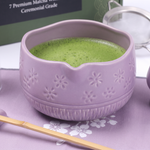 Lavender ceramic matcha bowl close-up with whisked matcha and embossed sakura relief