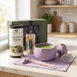 Purple matcha gift set on a kitchen counter with ceremonial matcha tin