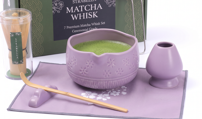 Purple matcha set arranged on lavender sakura mat