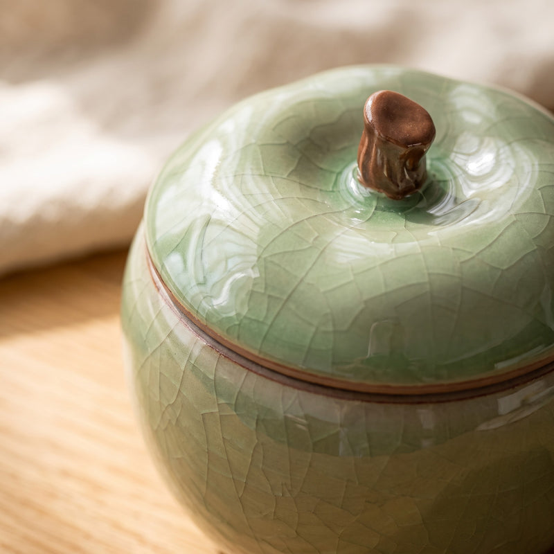 Trinket jar — close-up of the light green crackle glaze and brown stem knob