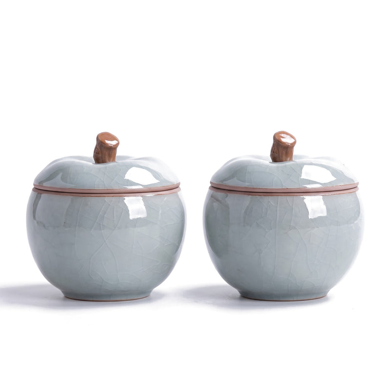 Trinket jar set of 2 — azure ceramic apple jars with stem-knob lids on white