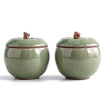 Trinket jar set of 2 — light green ceramic apple jars with stem-knob lids on white