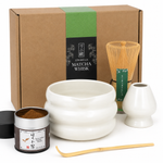 White Strabella Hojicha Set with an open tin of stone-milled Kyoto hojicha powder, bamboo whisk and ceramic bowl